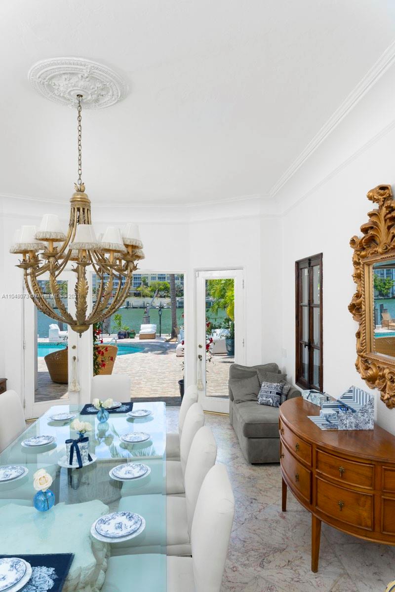 Outdoor seating area at 8-bed waterfront villa, Pine Tree Dr, Miami, for sale