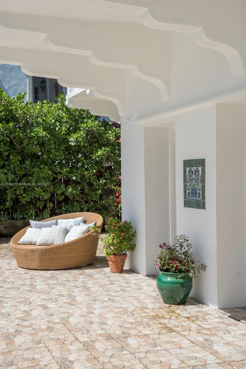 Luxury Miami villa with pool, spacious patio, and elegant balcony at Pine Tree Dr estate