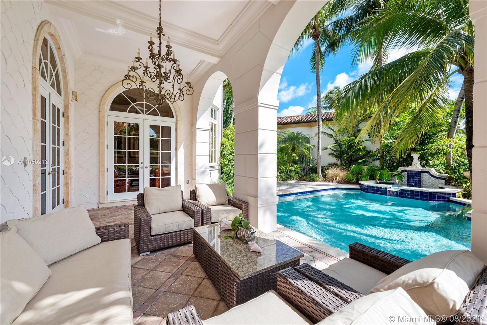 Exquisite seven-bedroom villa exterior with lush greenery on Fisher Island, Miami, Florida