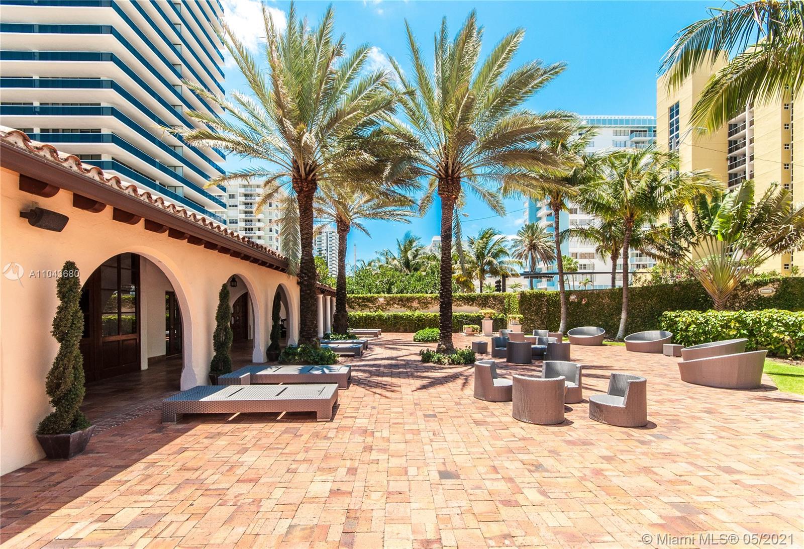 Front entrance of luxury villa at 5959 Collins Ave, Miami, for sale