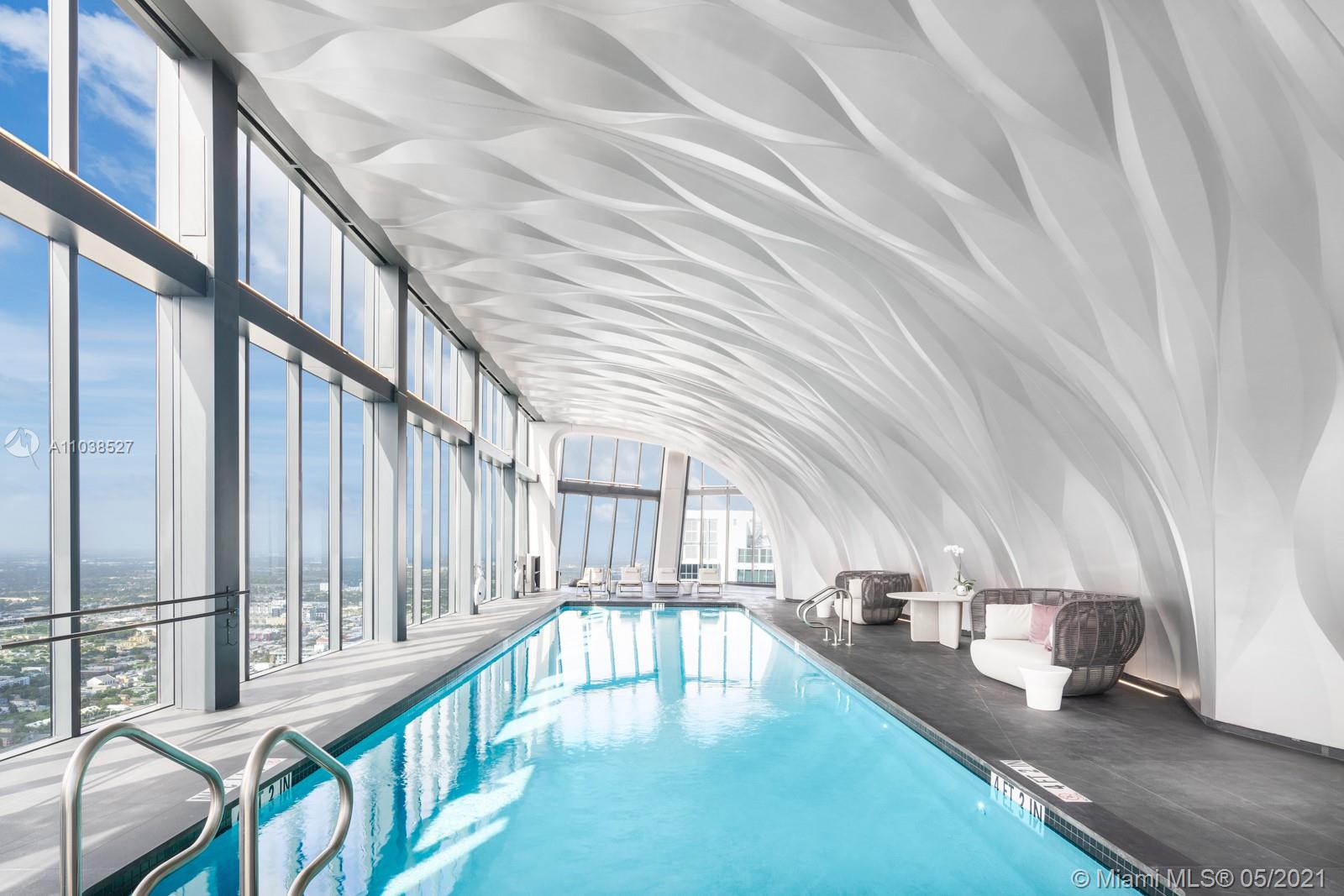 Luxurious Miami Beach villa interior with panoramic ocean views, modern design, and elegant furnishings