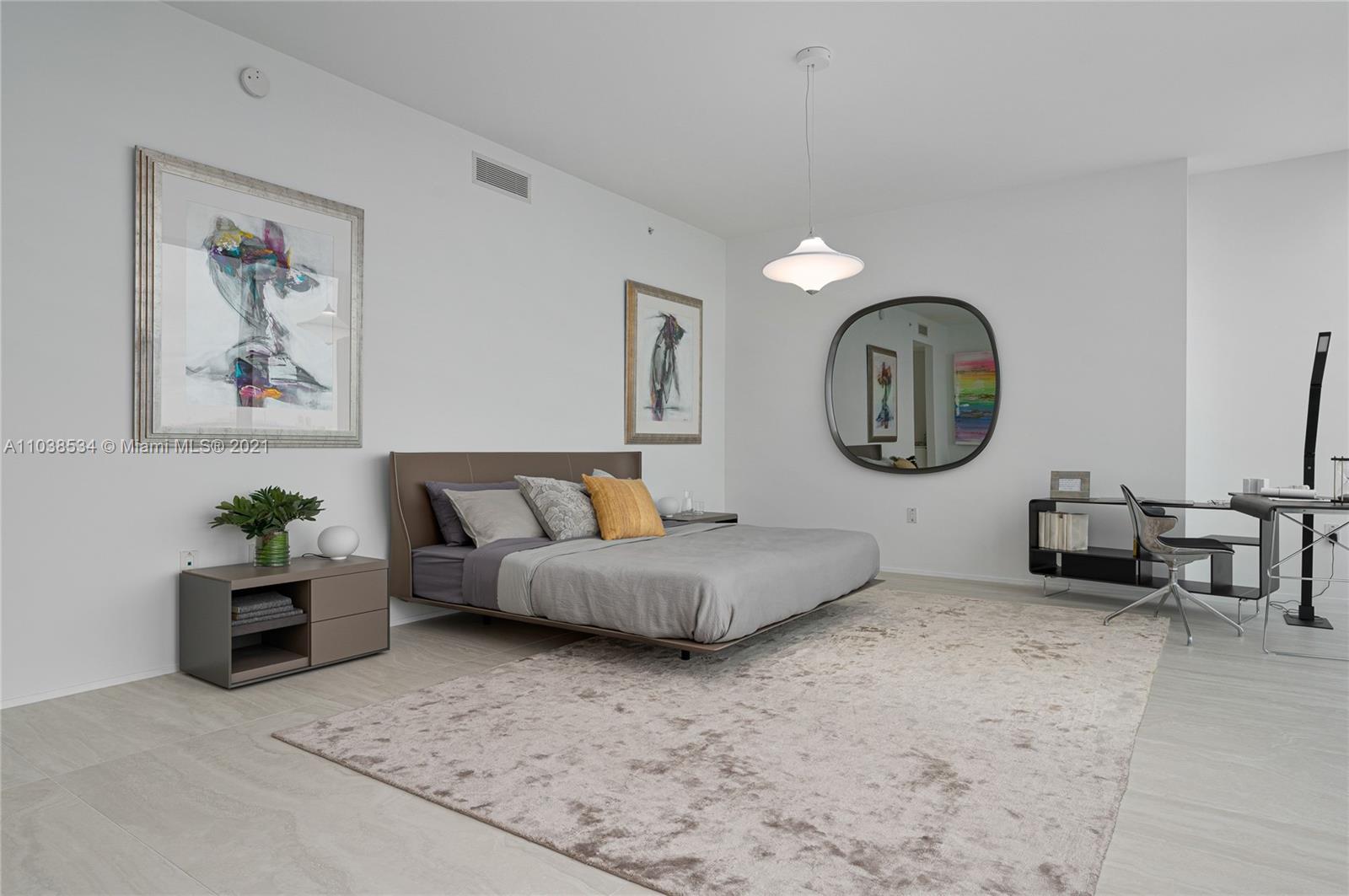 Luxurious Miami villa bedroom with stunning floor-to-ceiling windows and ocean views