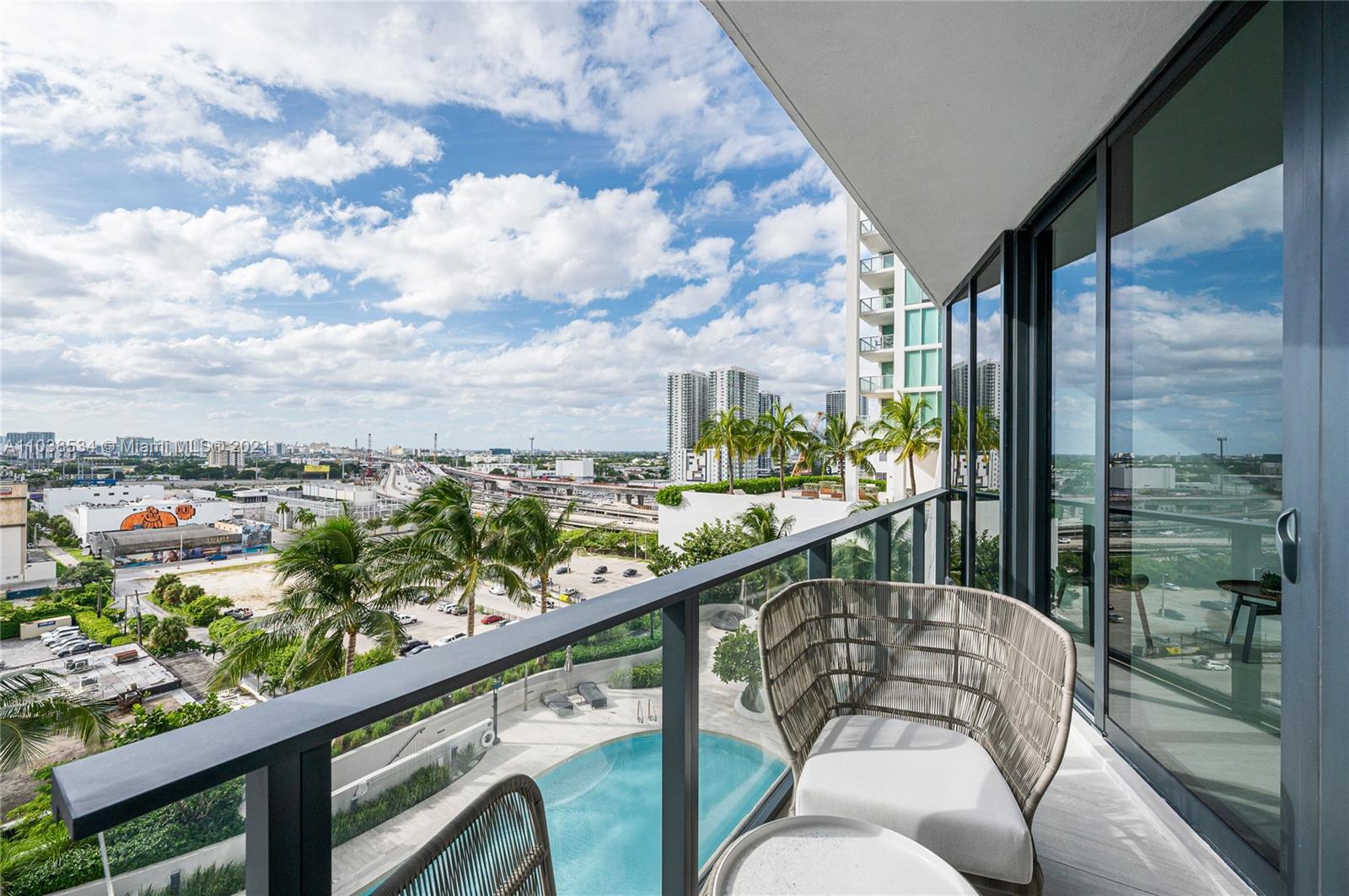 Luxurious Miami villa living room with balcony and stunning city view, 1000 Biscayne Blvd