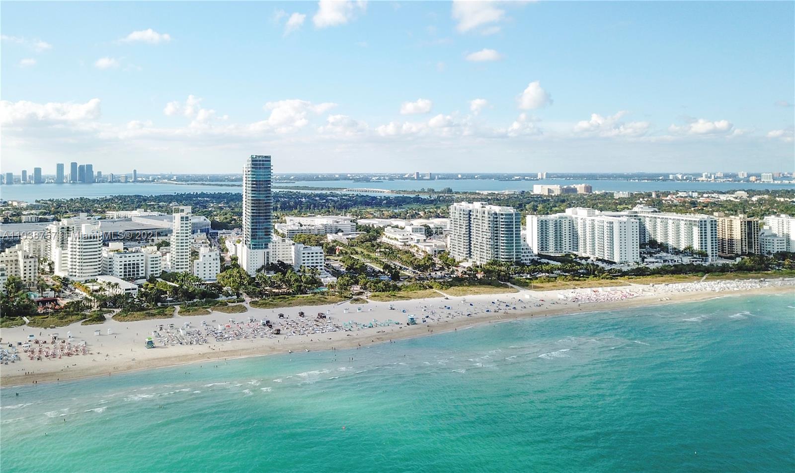 High floor villa view, palm trees, and beach at 101 20th St, Miami, Florida