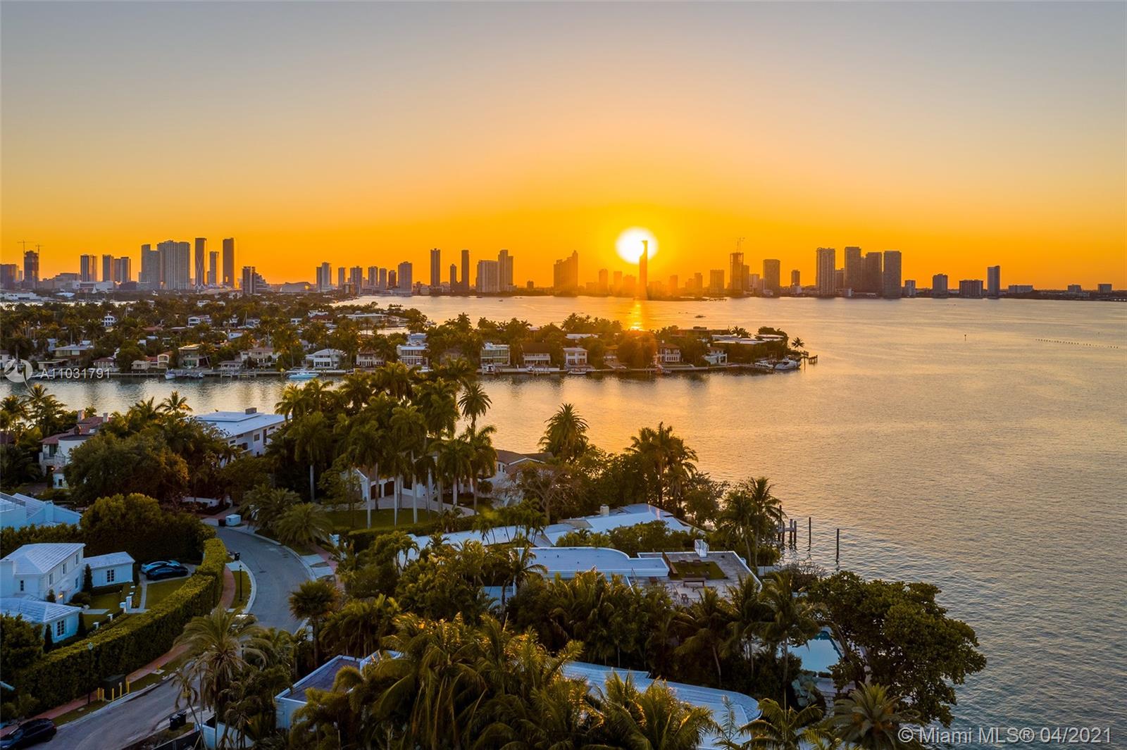Bayfront villa at sunset in Miami, Florida, overlooking water and city skyline