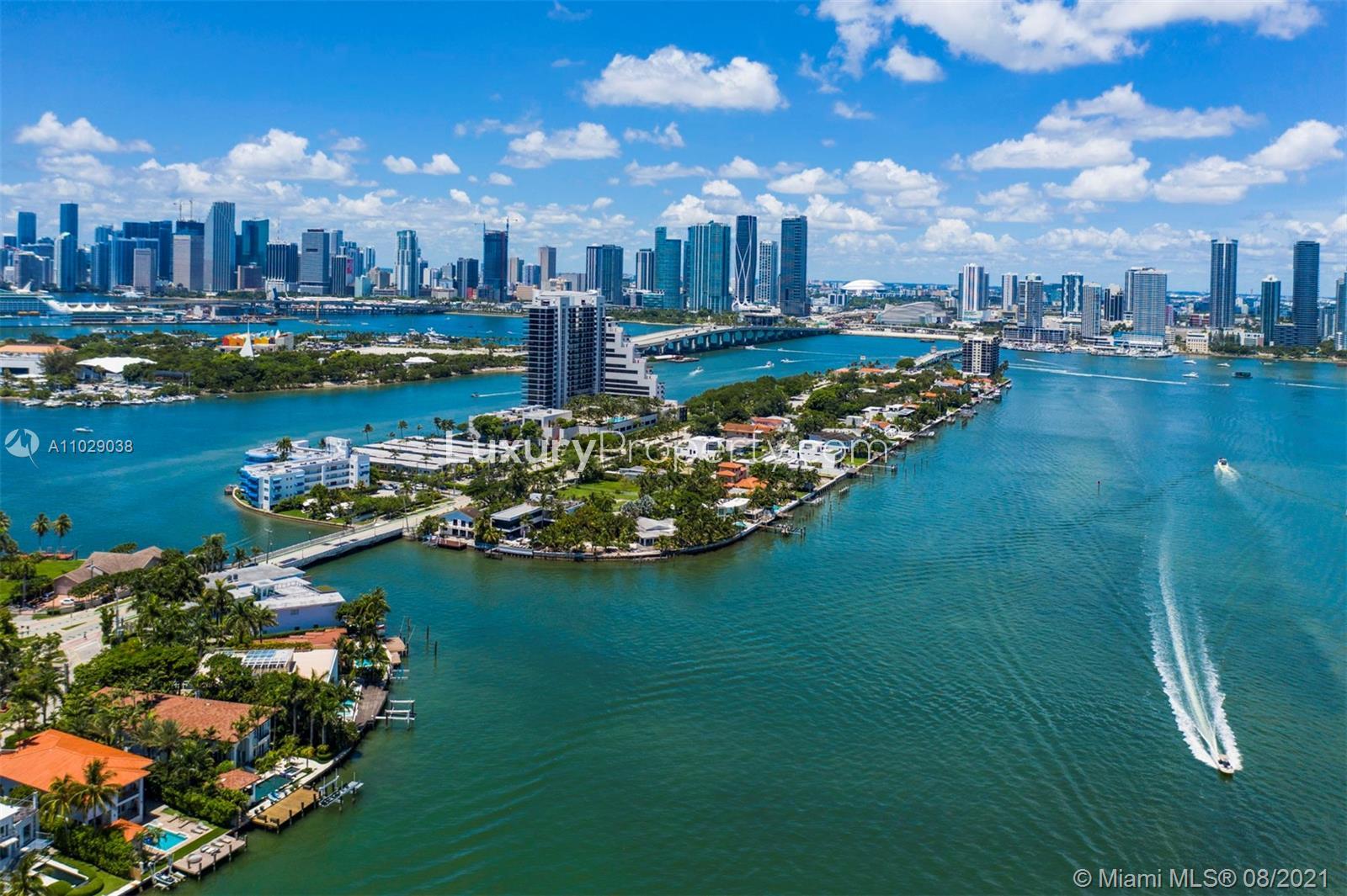 Aerial view of Miami Beach waterfront villa for sale, skyline in background