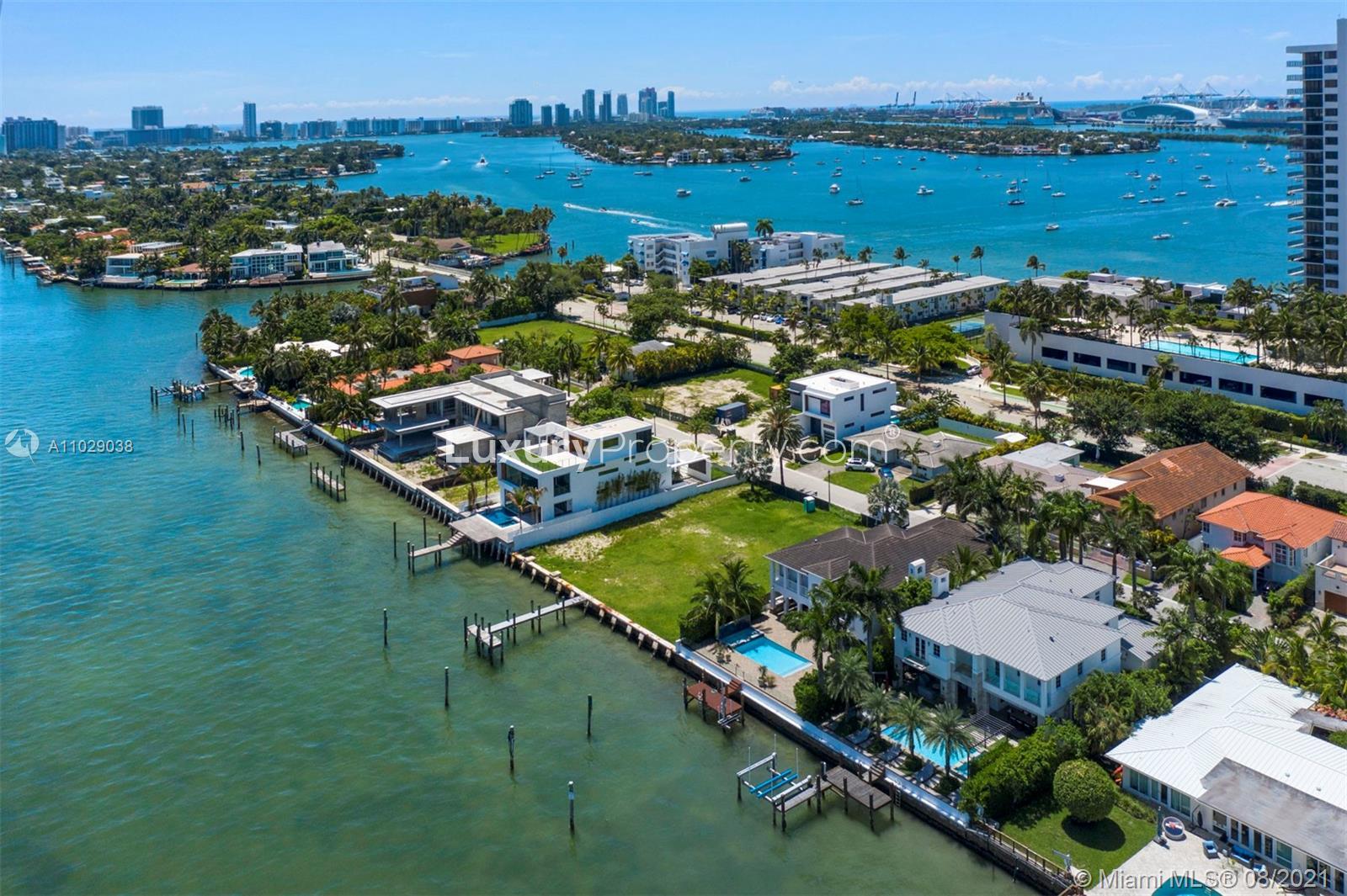 Aerial view of waterfront villas in Miami Beach, showcasing luxury homes and scenic bay