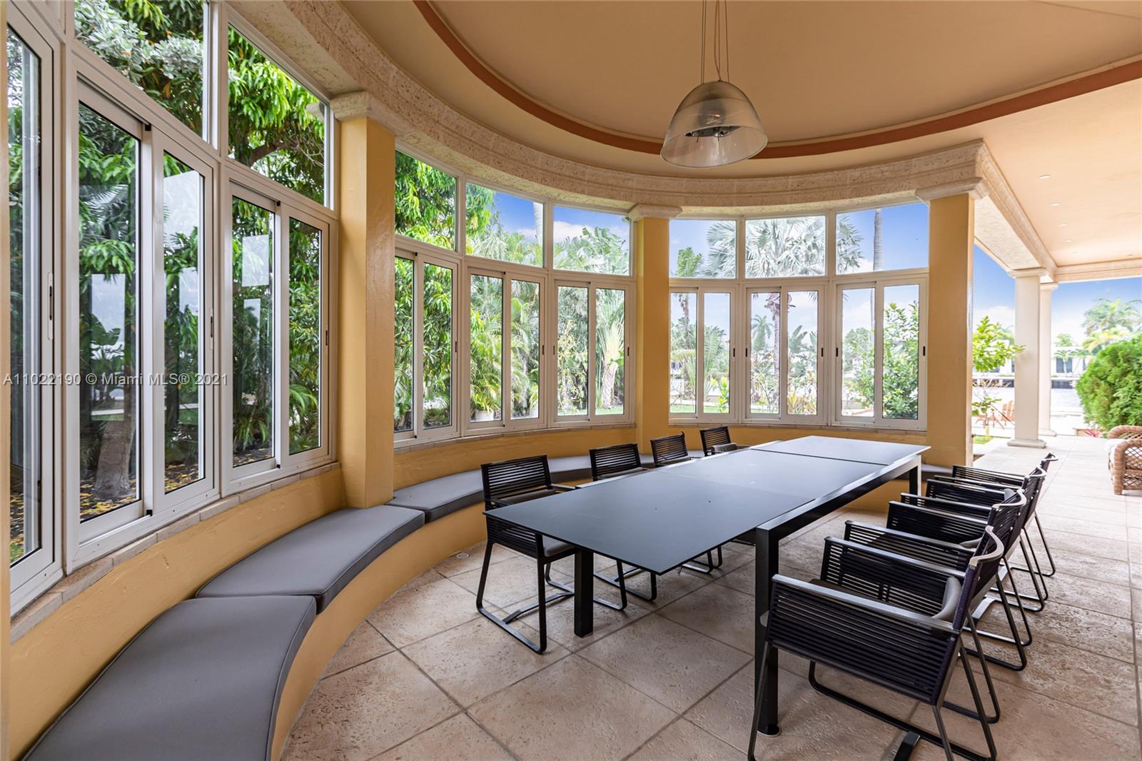 Outdoor patio with dining set and grill at luxury villa, Fort Lauderdale, Florida