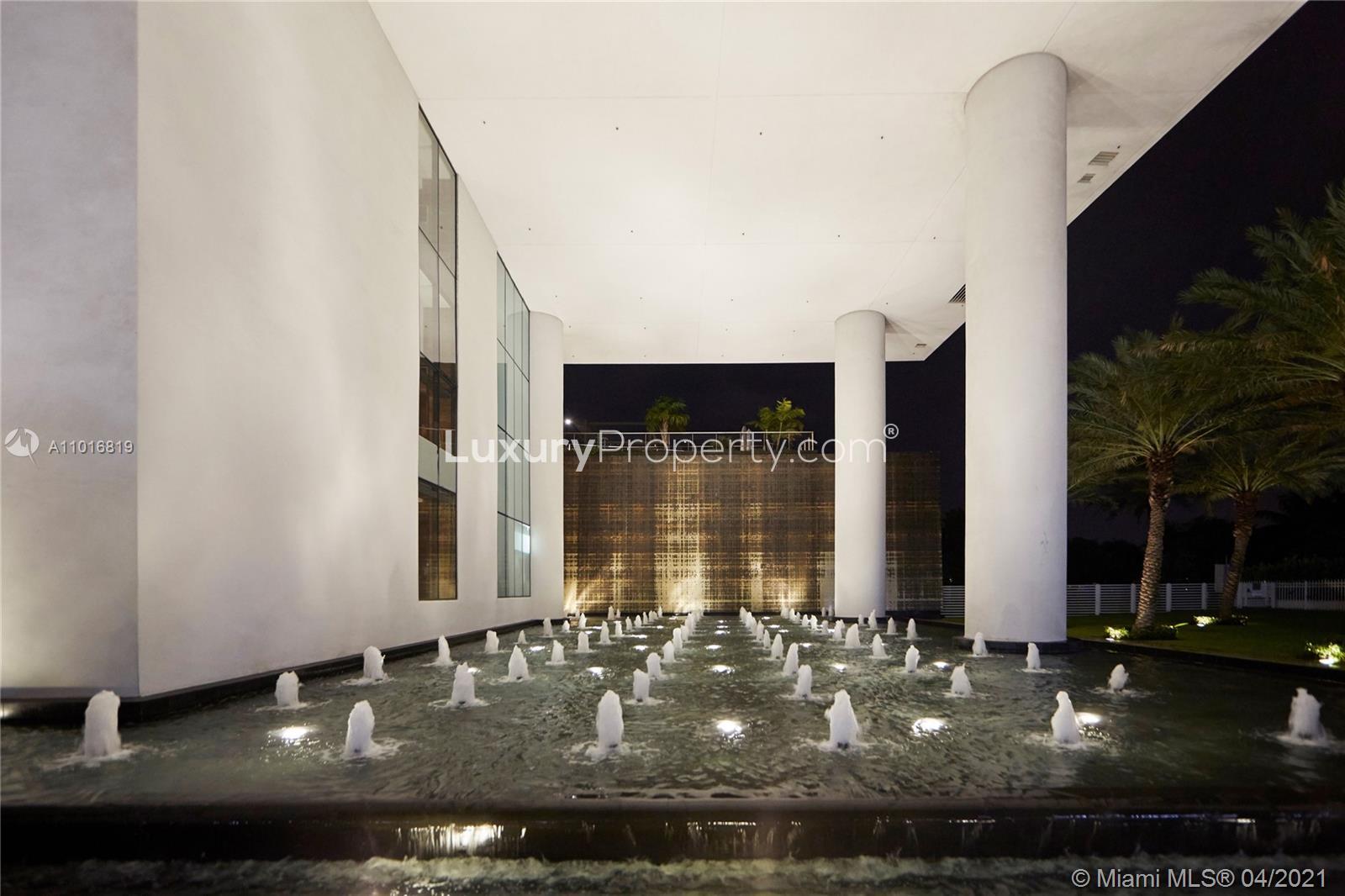 Luxurious Miami villa with pool and sea view at night, 800 S Pointe Dr 604