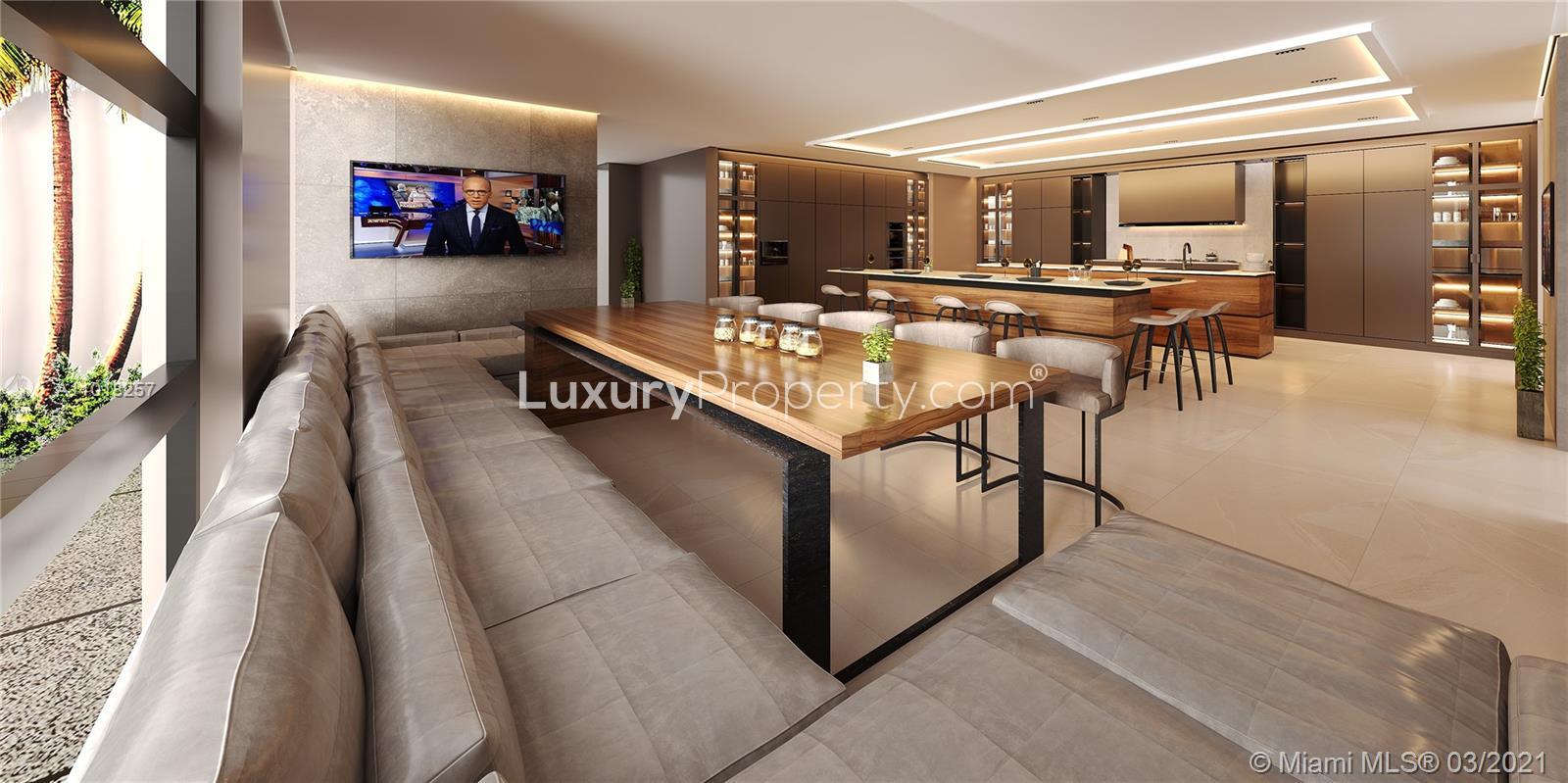 Luxurious modern kitchen in Miami villa, featuring sleek design and ample seating