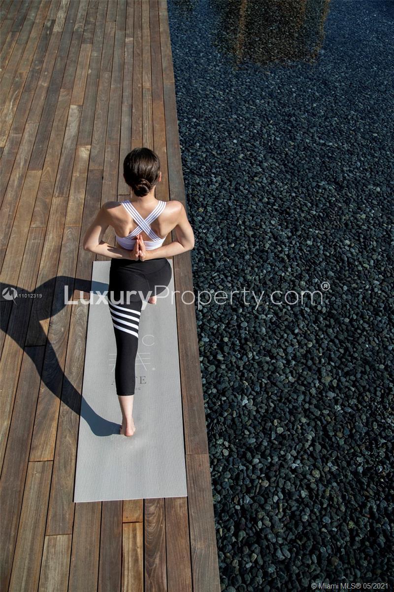 Miami Beach villa with lush greenery and ocean view, ideal for luxury living