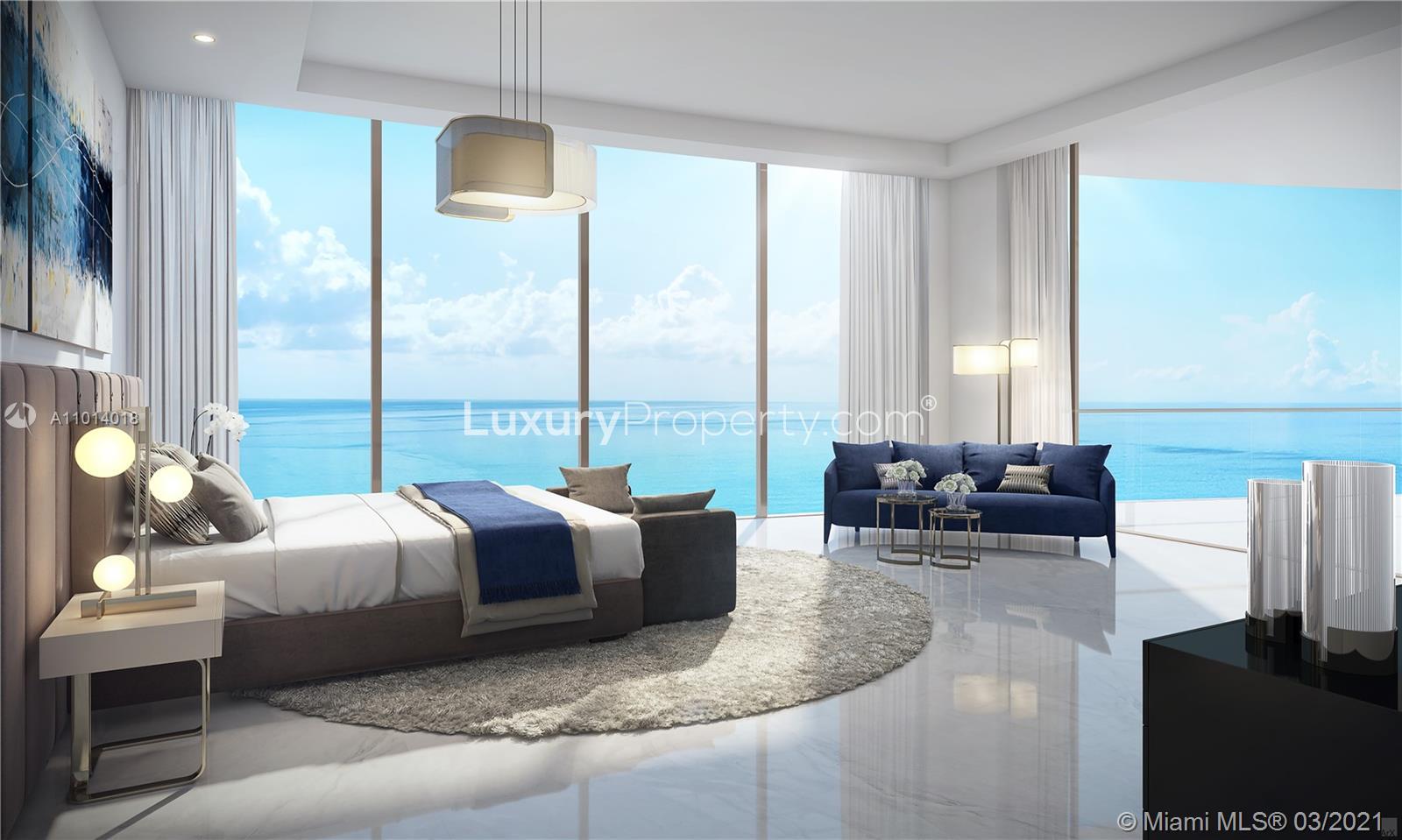 Luxurious Miami villa living room with ocean view, modern decor, and elegant fireplace