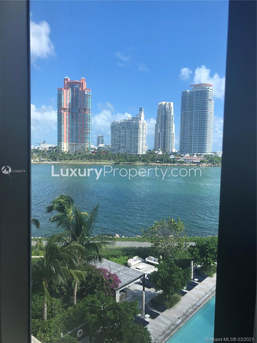 Three-bedroom condo in Miami with ocean, golf course views, and pool on Fisher Island