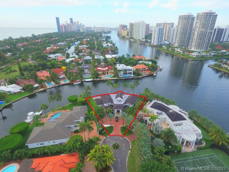 Luxurious waterfront villa with palm trees, Golden Beach, Florida, spacious architecture, for sale