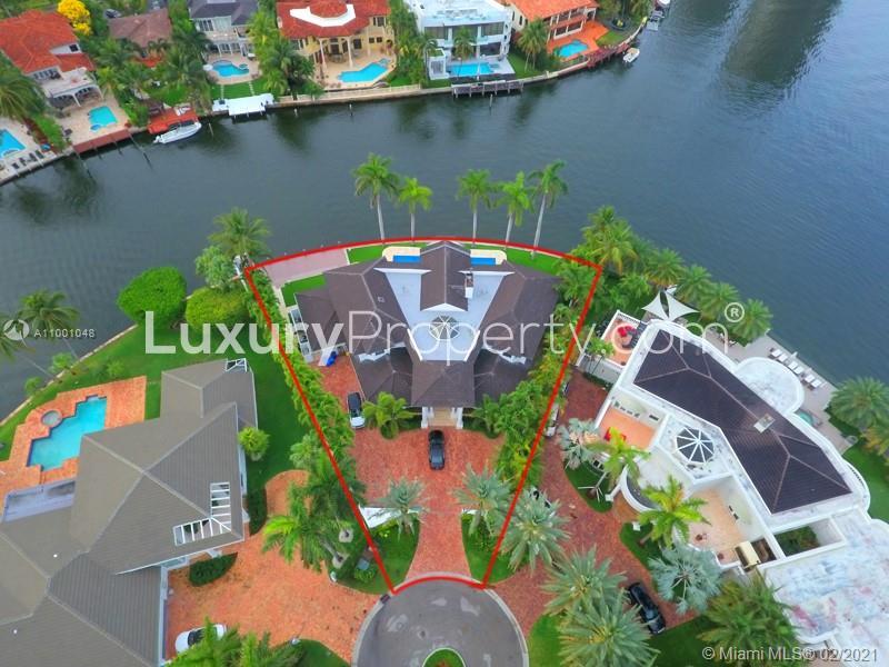 Aerial view of luxurious villa for sale in Golden Beach, Florida, with waterfront location