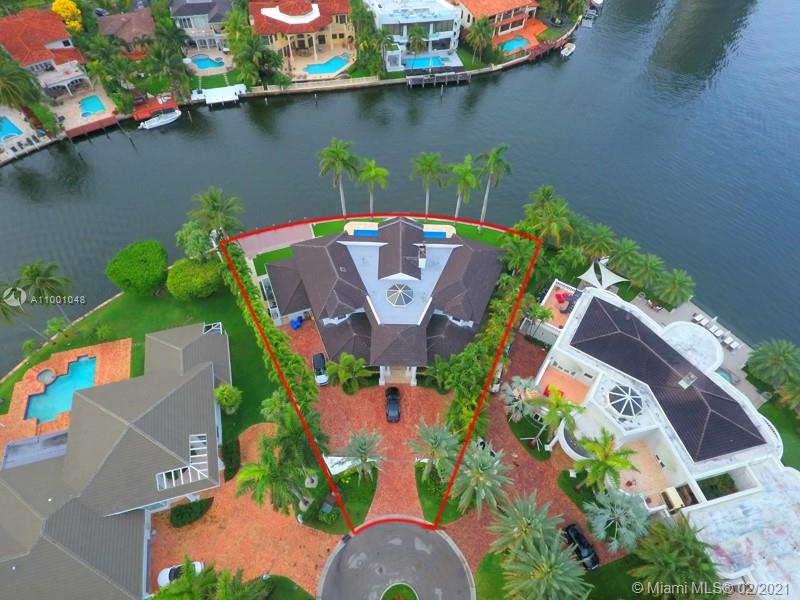 Aerial view of luxurious villa for sale in Golden Beach, Florida, with waterfront location