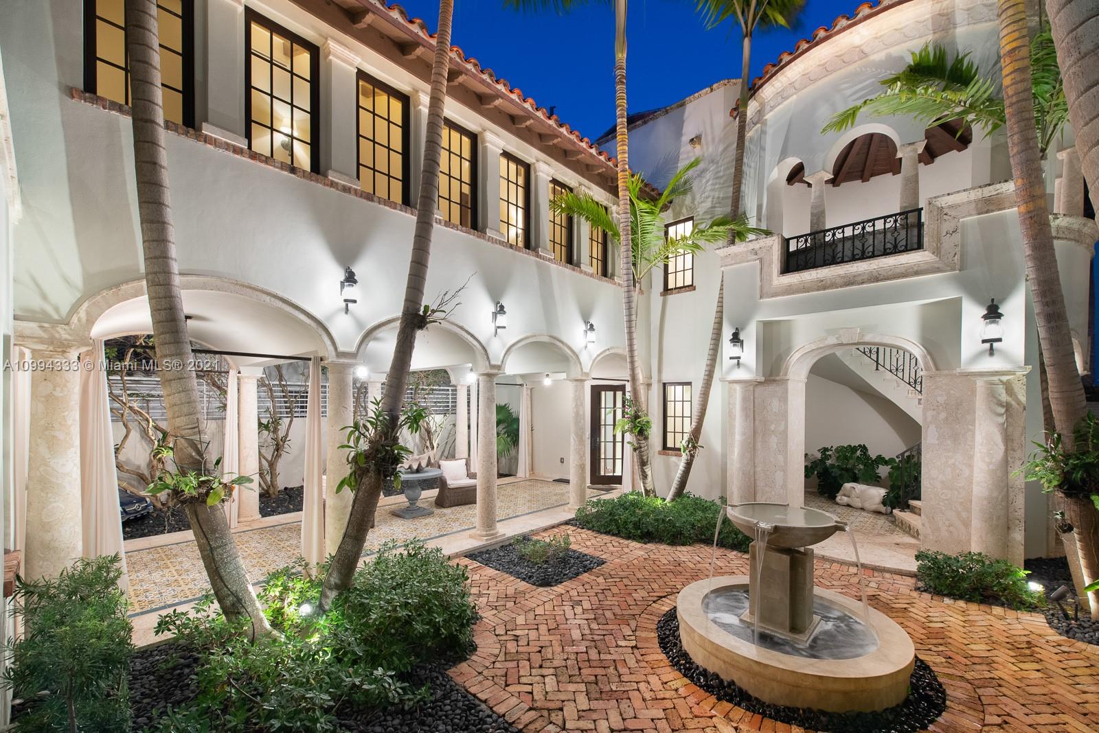 Spanish Mediterranean villa with pool at sunset, Miami, Florida. 7 bedrooms, 7 bathrooms