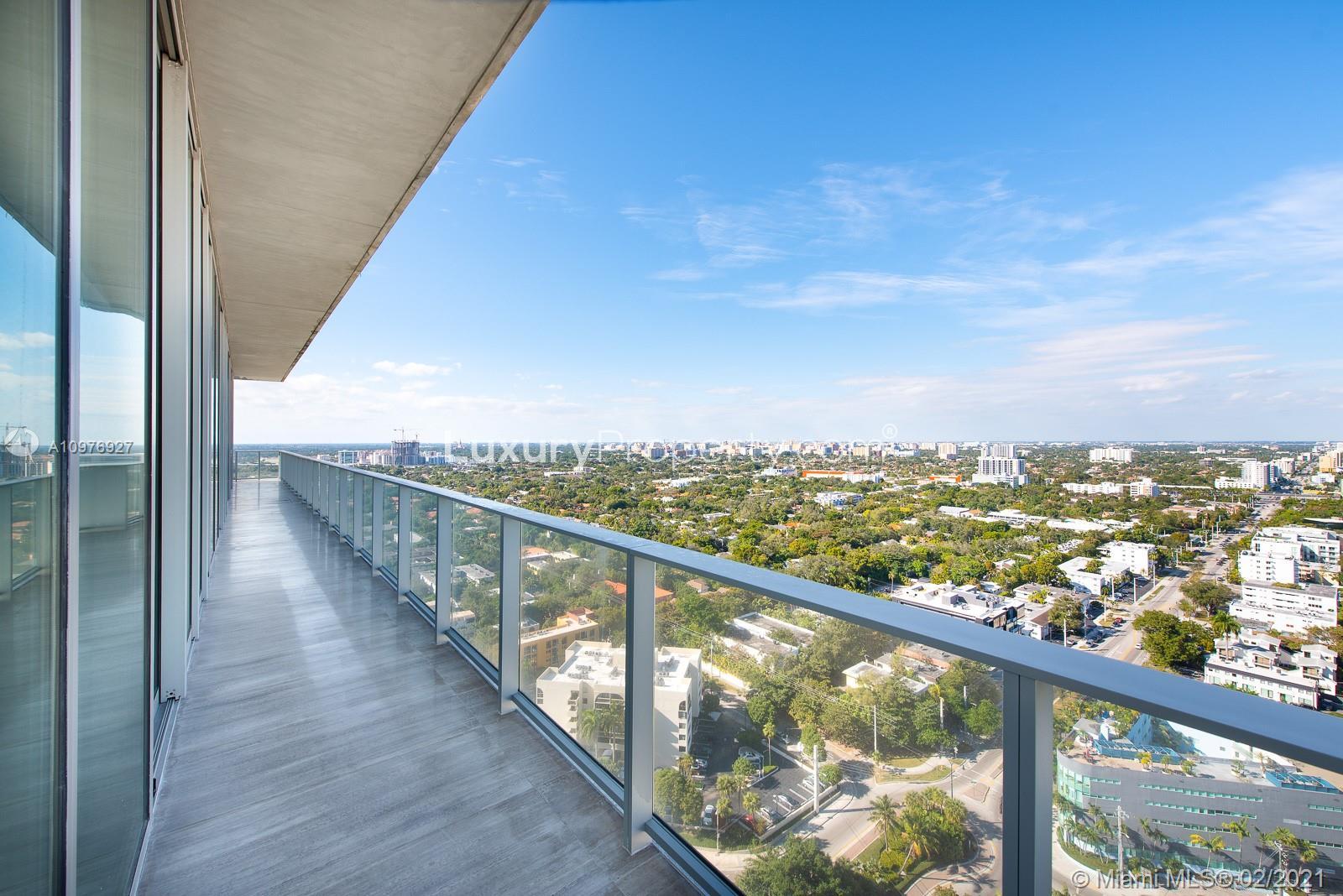 Luxury Miami villa balcony with ocean and city skyline views at 2669 S Bayshore Dr