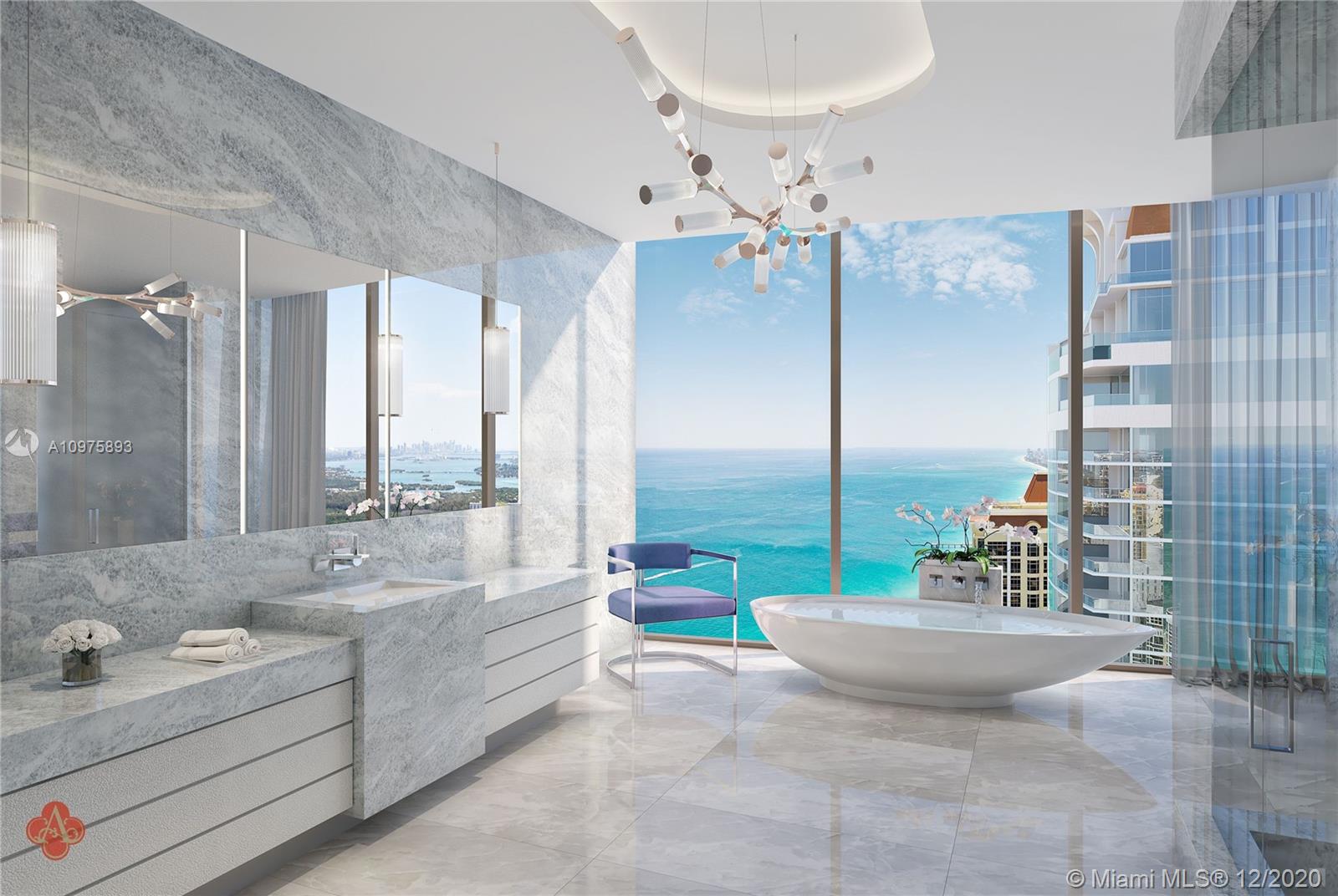 Luxurious Miami villa with ocean view, modern kitchen, and elegant dining area for sale