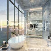 Luxurious Miami villa living room with ocean view, elegant furnishings, and modern decor