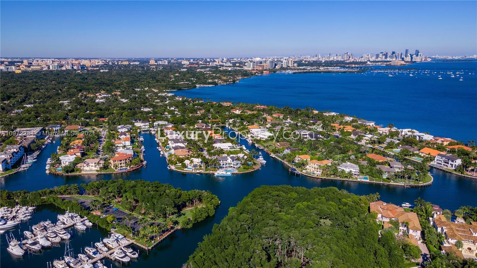 Waterfront view with yacht from luxury villa terrace in Coral Gables, Miami