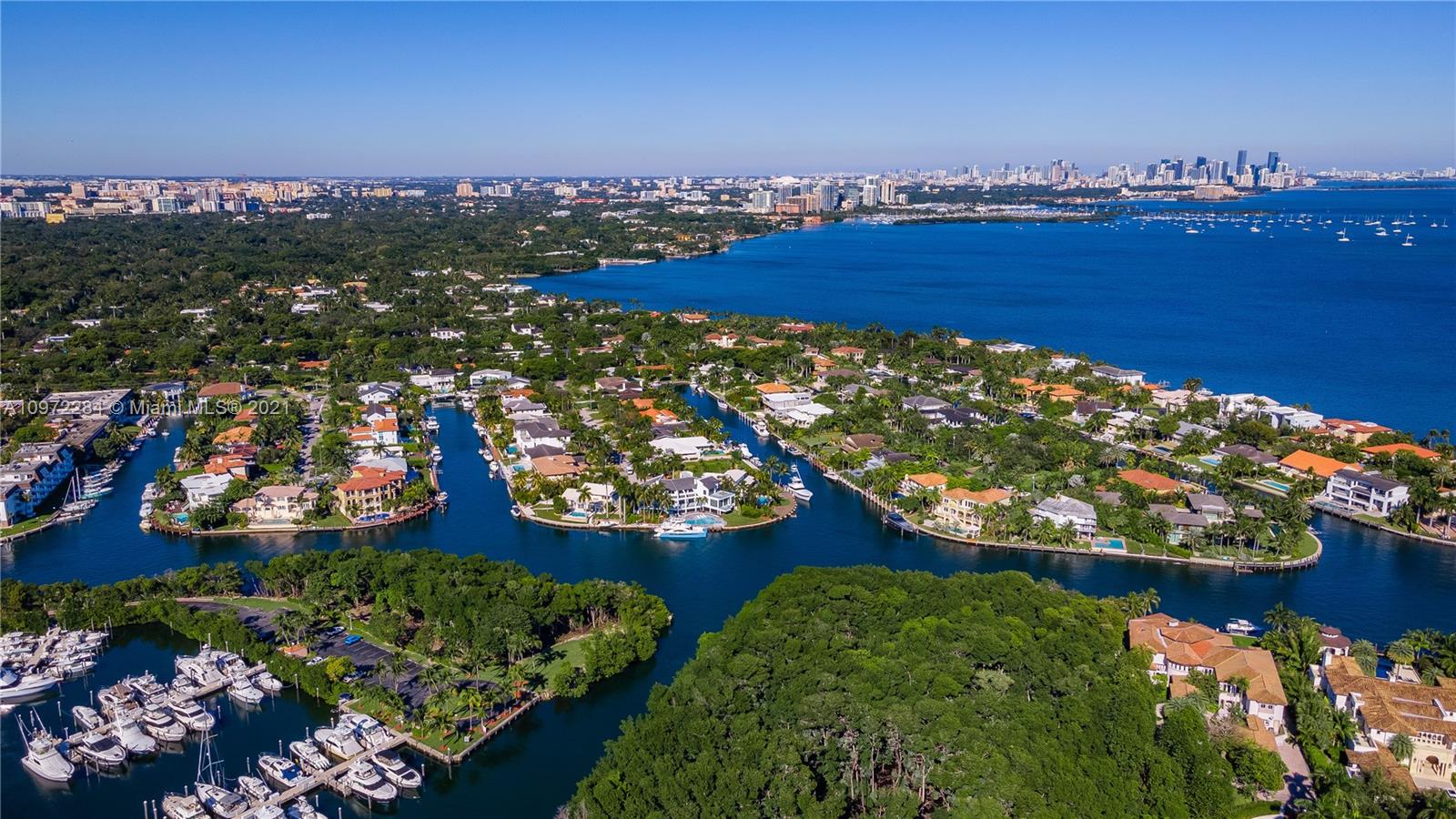 Waterfront view with yacht from luxury villa terrace in Coral Gables, Miami
