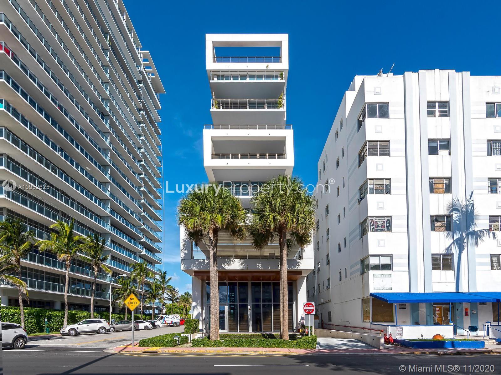 Luxury Miami Beach villa balcony with ocean view, palm trees, and stylish outdoor seating
