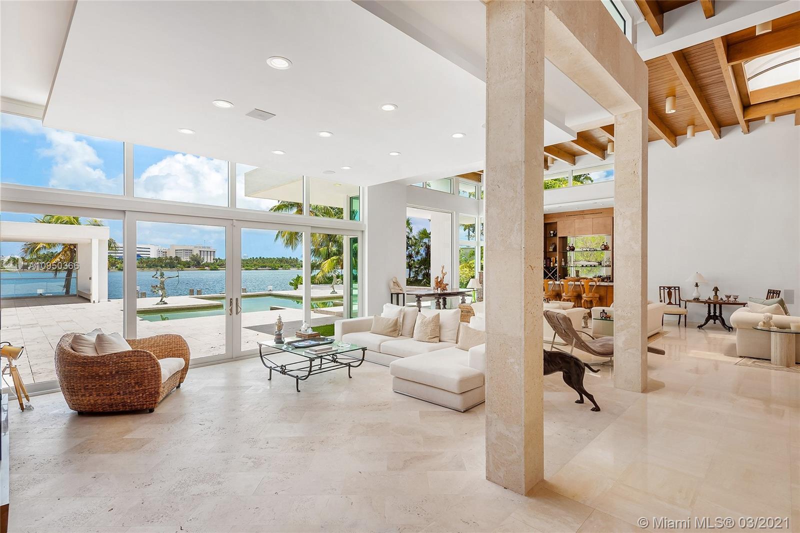 Luxurious Miami Beach villa with pool and waterfront view at dusk