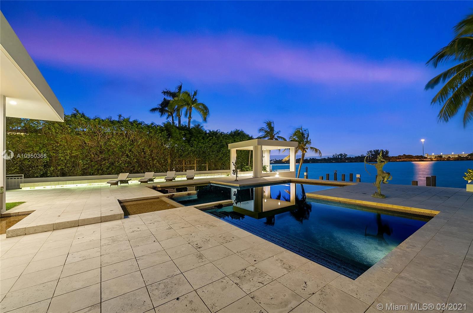 Luxurious living room in Miami Beach villa with modern decor and fireplace