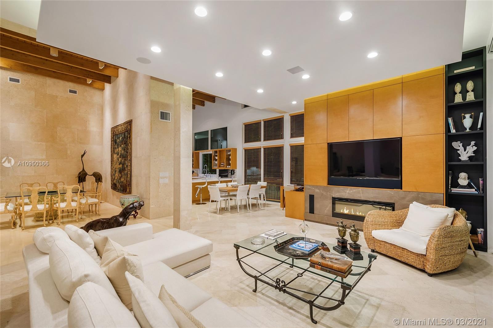 Luxury Miami Beach villa with pool, modern design, lush greenery, twilight view