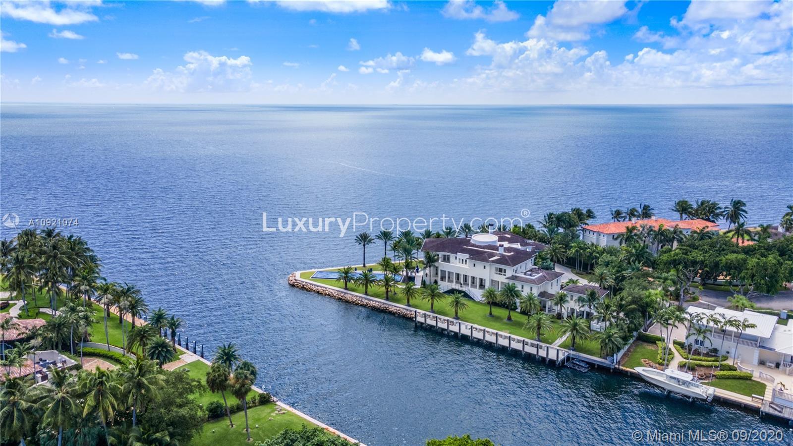 Waterfront villa at 41 Arvida Parkway, Miami, with stunning ocean views and lush greenery