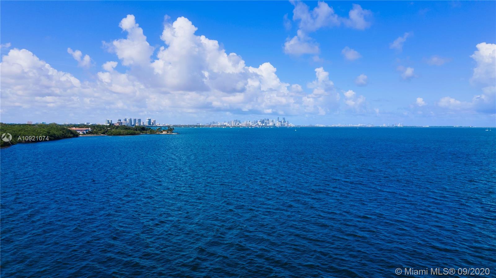 Luxurious Miami waterfront villa with pool at sunset, 41 Arvida Parkway