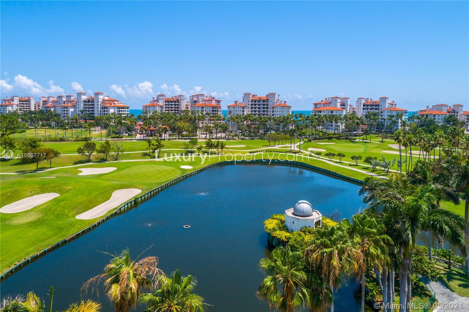 Aerial view of Miami Beach villa community, golf course, and tennis courts