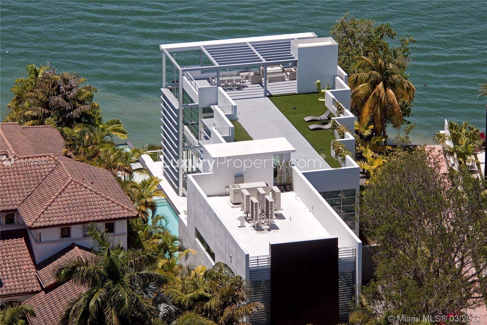 Tri-Level Waterfront Villa with Rooftop Terrace in Miami, Florida - For Sale