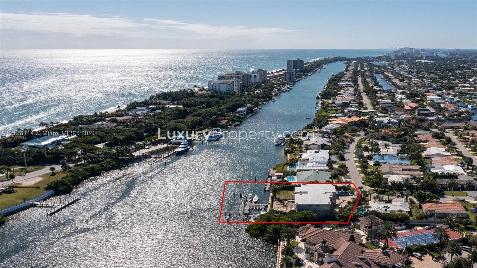 Aerial view of waterfront villa with private dock in Miami, Florida, for sale