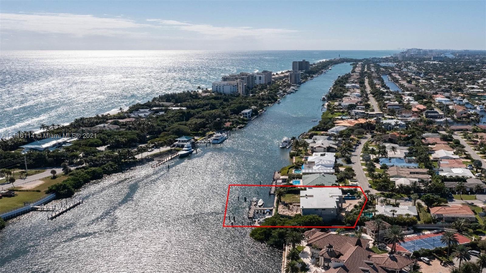 Aerial view of waterfront villa with private dock in Miami, Florida, for sale