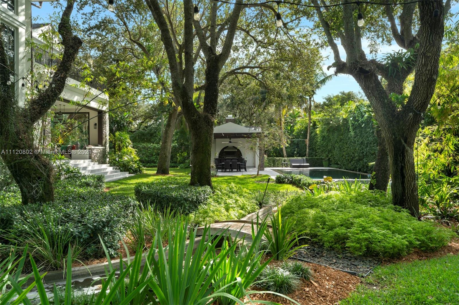 Luxurious eight-bedroom villa for sale in Miami, Florida with spacious garden and elegant design