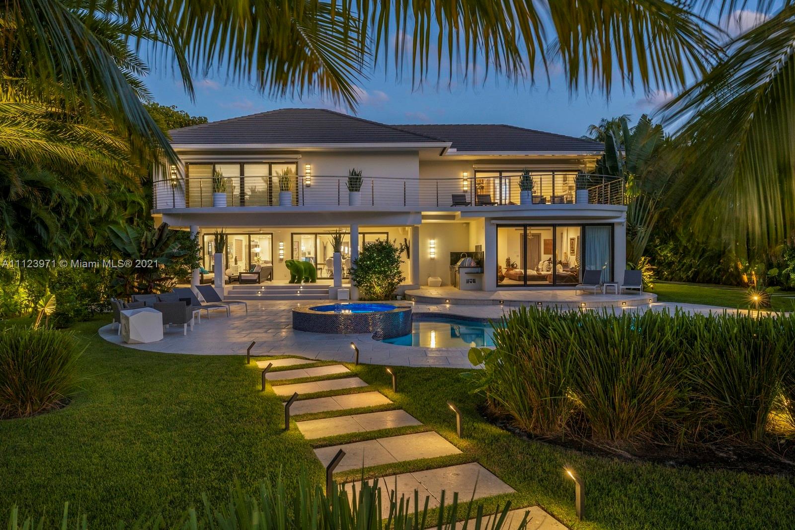 Luxurious waterfront villa with pool at 1380 Biscaya Dr, Miami, featuring modern architecture