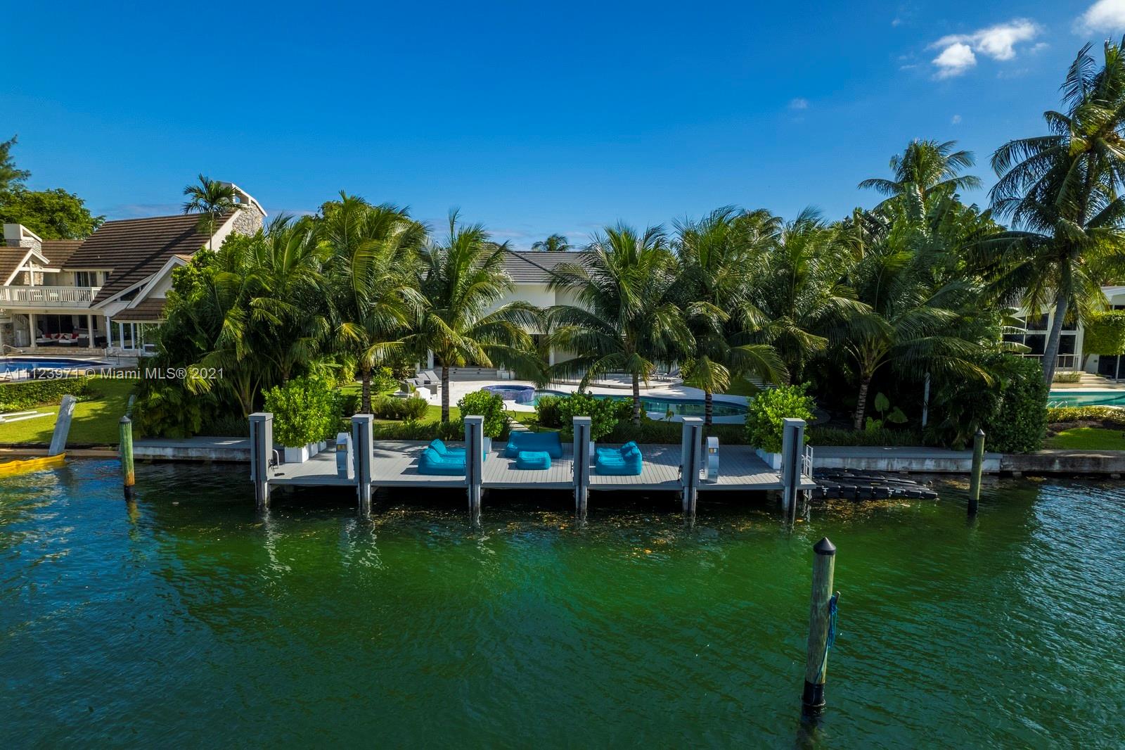 Waterfront furnished villa with private dock and lush greenery at 1380 Biscaya Dr, Miami