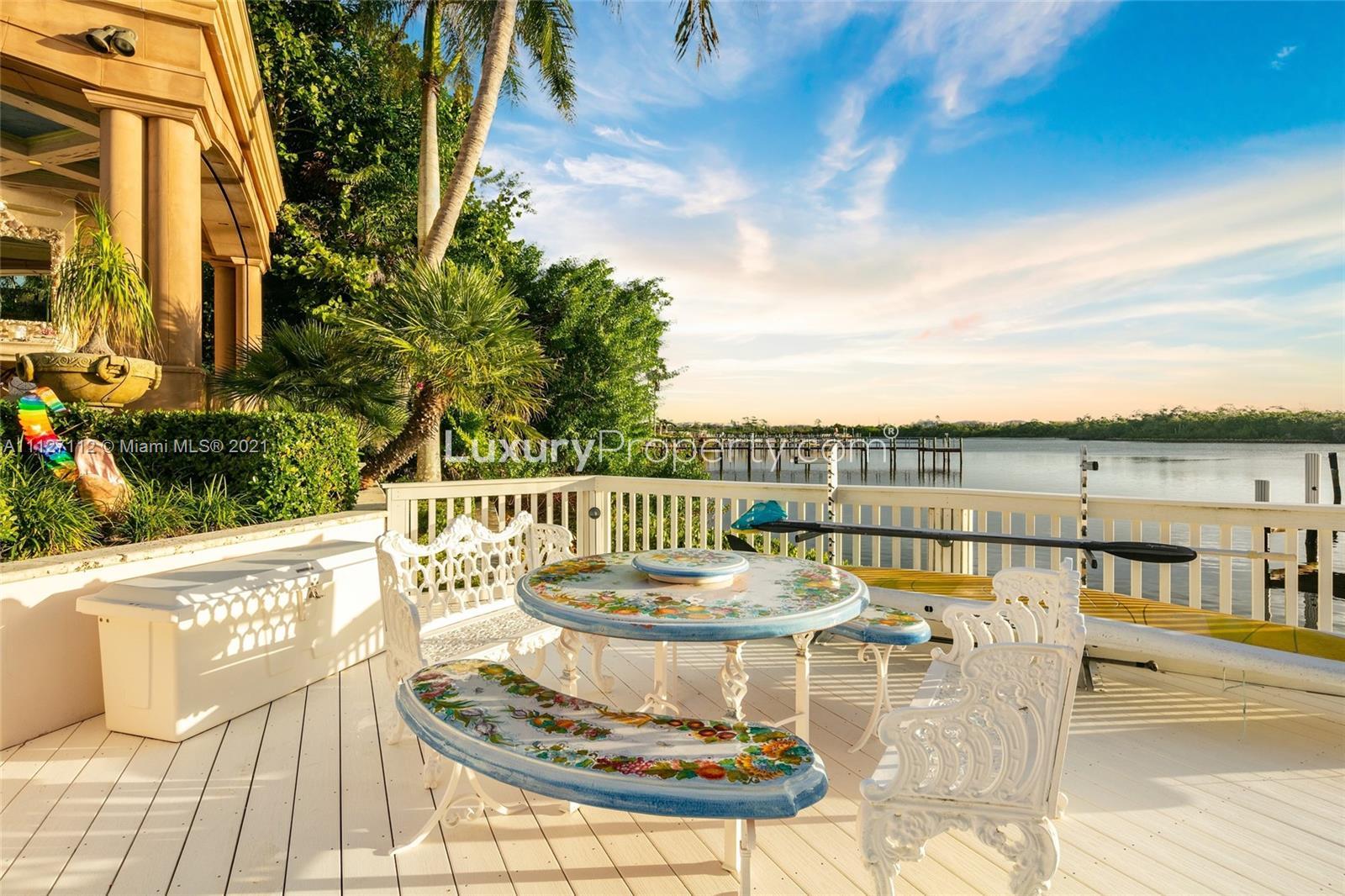 Sunset view from villa deck overlooking water at 372 Regatta Dr, Jupiter, Florida