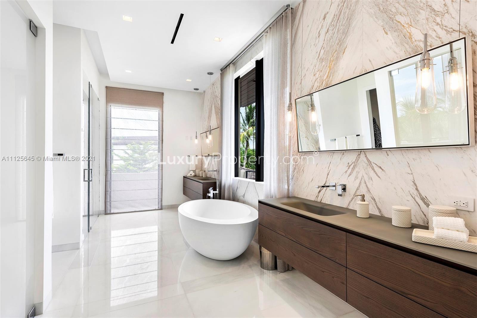 Luxury waterfront villa with pool for sale in Miami, Florida. 7 bedrooms, 7 bathrooms