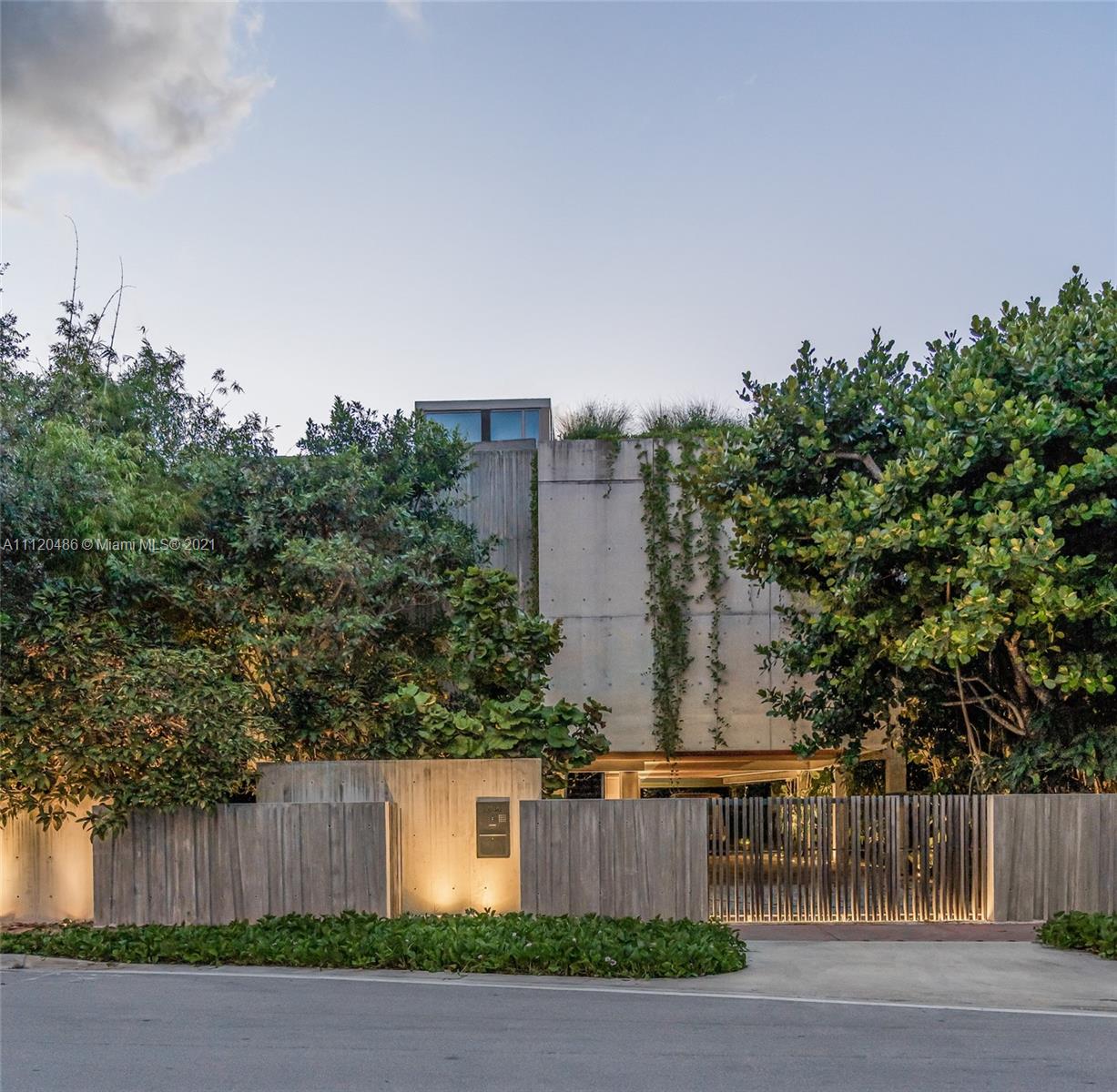 Furnished villa living area with pool view, modern design, Miami, Florida