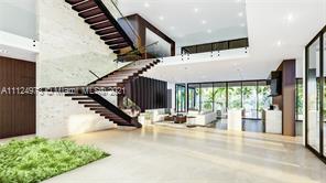 Modern living room in oceanfront villa, Golden Beach, Florida, with ocean views through windows