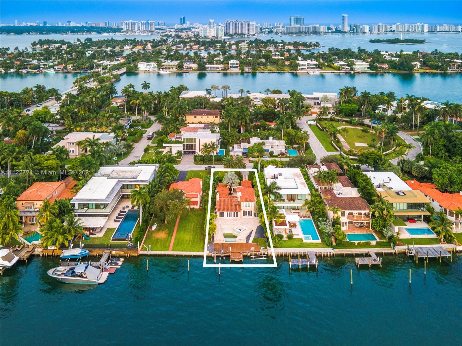 Modern Miami villa exterior with lush landscaping and sleek architectural design at 114 W San Marino Dr