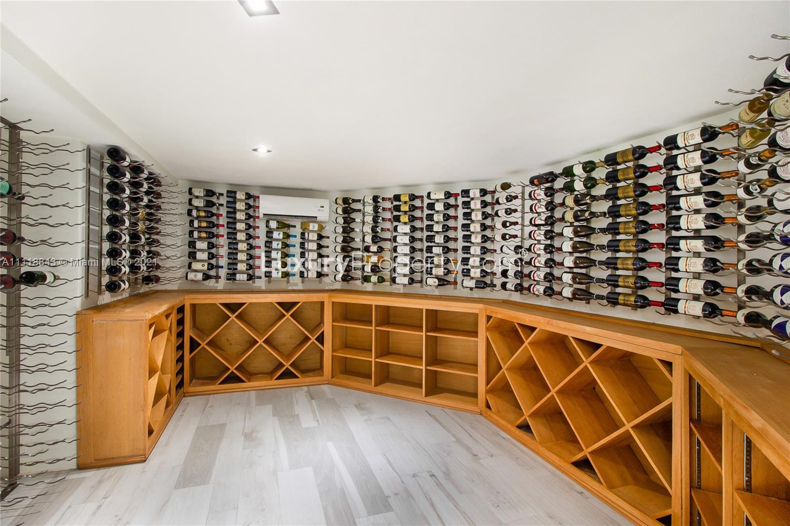 Waterfront villa with dock and palm trees at 750 S Mashta Dr, Miami for sale