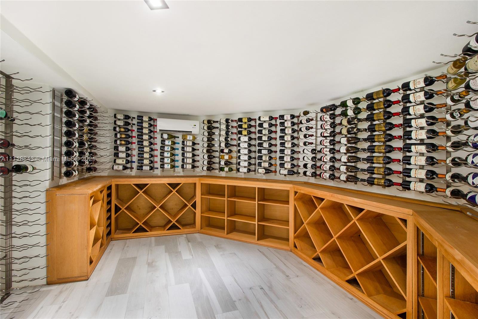 Waterfront villa with dock and palm trees at 750 S Mashta Dr, Miami for sale