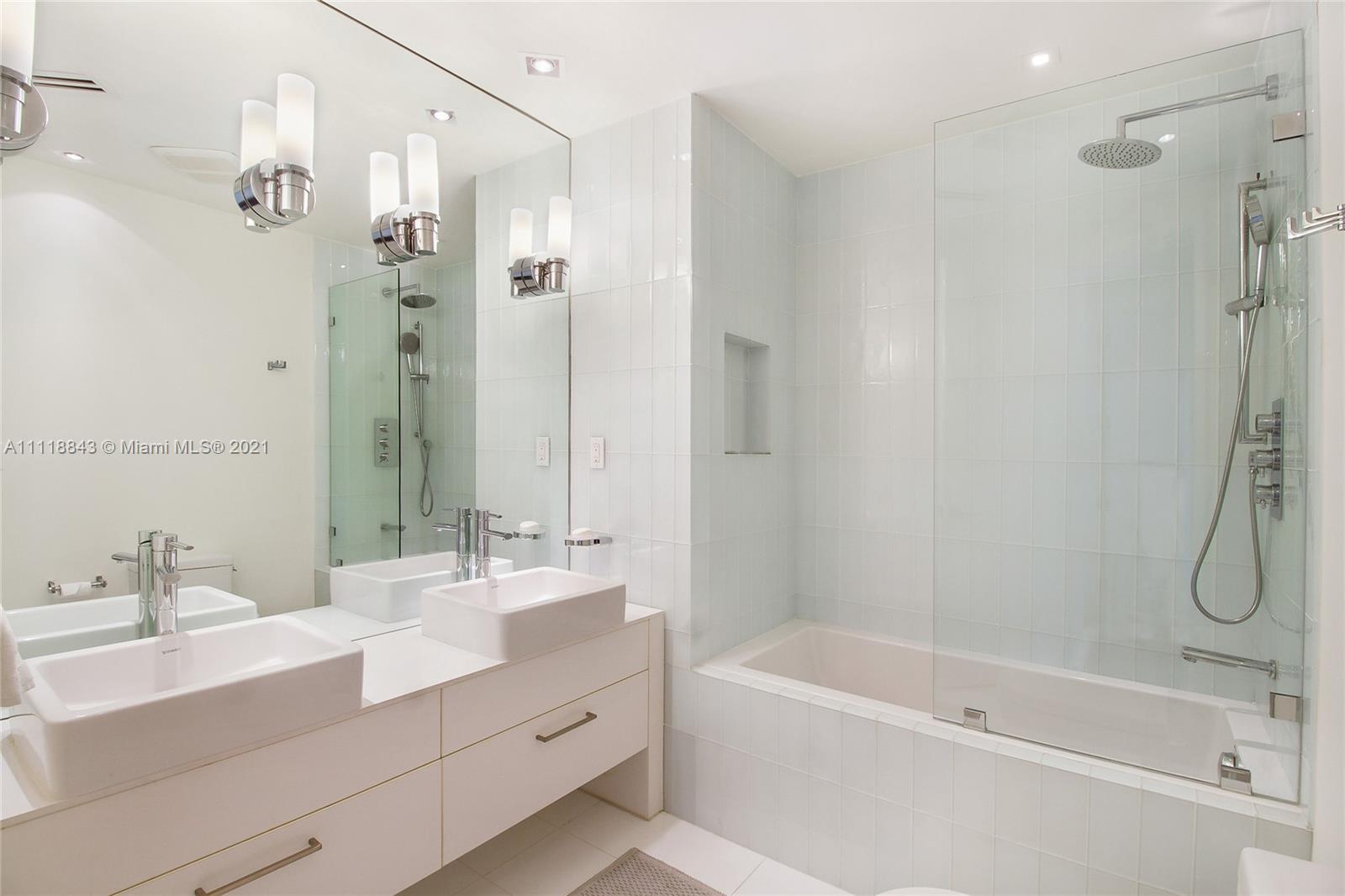 Modern home office in Miami villa at 750 S Mashta Dr, featuring sleek shelving