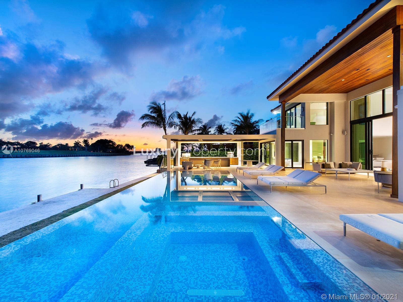 Luxurious 7-bedroom waterfront villa with pool at 9420 W Broadview Dr, Miami for sale