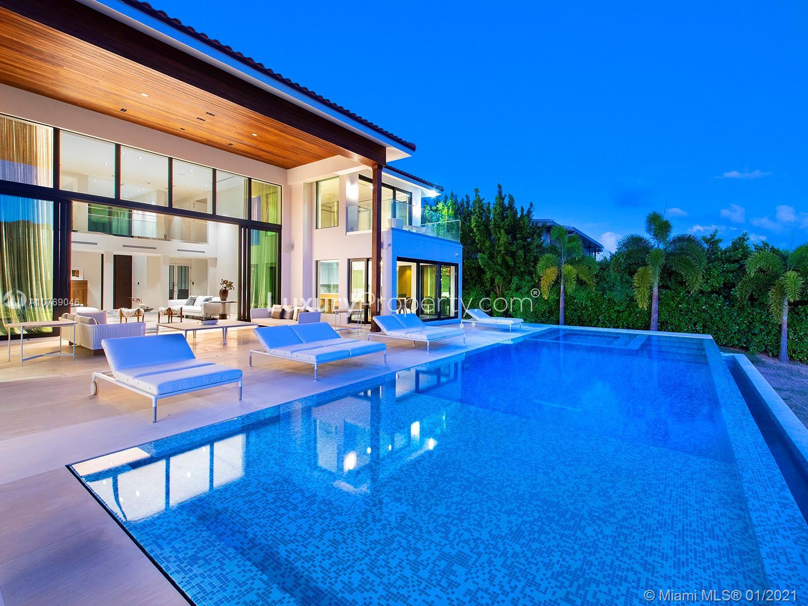 Waterfront villa with pool, modern design at 9420 W Broadview Dr, Miami for sale