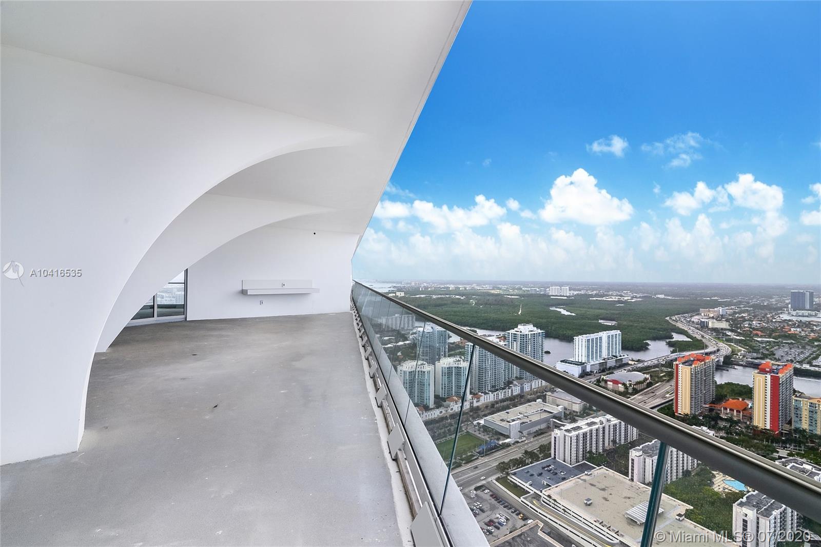 Penthouse balcony with panoramic downtown Miami view, 5-bed villa at 16901 Collins Avenue